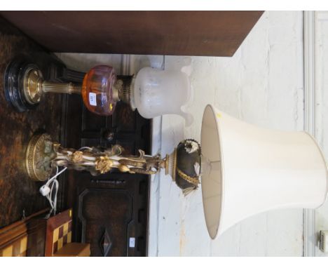 A ceramic oil lamp in the form of waterlillies and flowers, probably Moore Bros, converted to electricity 59cm high, and a br