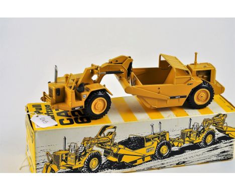 NZG MODEL 127 CAT 627 PUSH-PULL SCRAPER SCALE 1:50 VGC SLIGHT DAMAGE TO THE BOX