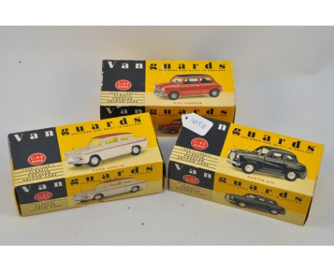 3 X VAN GUARDS 1:43 SCALE CARS 1 X RED/BLACK MINI COOPER, 1 X GREEN AUSTIN A 35, AND 1 X WHITE/MAROON FORD ANGLIA ALL BOXED N