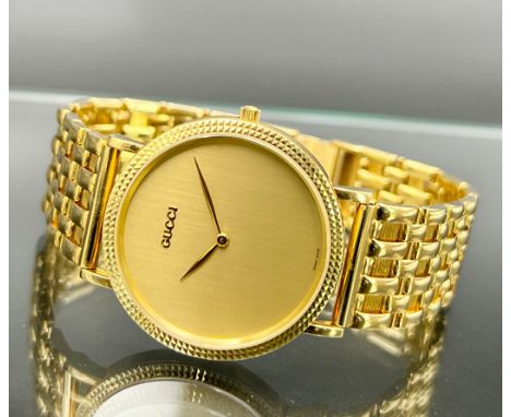 Armbanduhr. GUCCI. 750er Gelbgold. Quarz.Circa 33 mm im Durchmesser. Circa 20 cm. Circa 66,72 Gramm Gesamtgewicht. Modellnumm