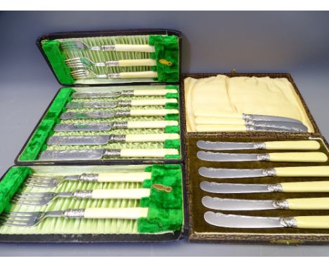 CASED EPNS CUTLERY to include a fish knife and fork set with bright cut decoration and carved handles and a set of six butter