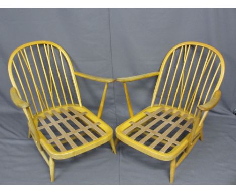 LIGHT ERCOL ARMCHAIRS, a pair having stick backs with hooped tops, 82cms H, 72cms W, 60cms seat depth, NOTE:&nbsp; The uphols