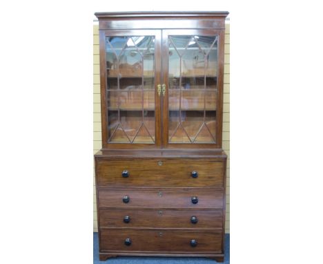 19TH CENTURY MAHOGANY BOOKCASE SECRETAIRE having twin upper glazed ten pane doors with adjustable interior shelving over a ba