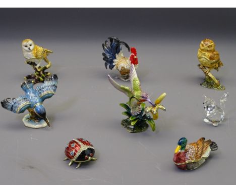 CRYSTAL SEATED CAT &amp; SEVEN ENAMEL DIAMANTE DECORATED LIDDED CONTAINERS in the form of various birds and an insect