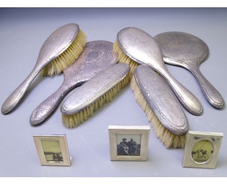 FIVE PIECE SILVER DRESSING TABLE HAND MIRROR &amp; BRUSH SET with a further non-matching hand mirror and three small modern s