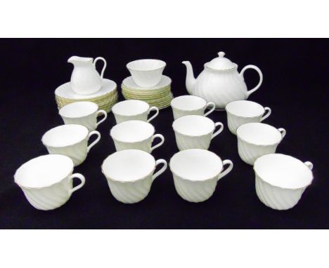 Wedgwood Gold Chelsea teaset for twelve place settings to include cups, saucers, plates, a milk jug, a sugar bowl and a teapo