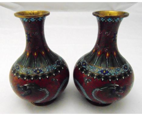 A pair of Chinese cloisonné baluster vases decorated with dragons chasing a flaming pearl, 16cm (h)