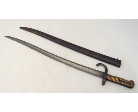 A continental late 19th century bayonet with brass handle and scabbard, 71cm (l)