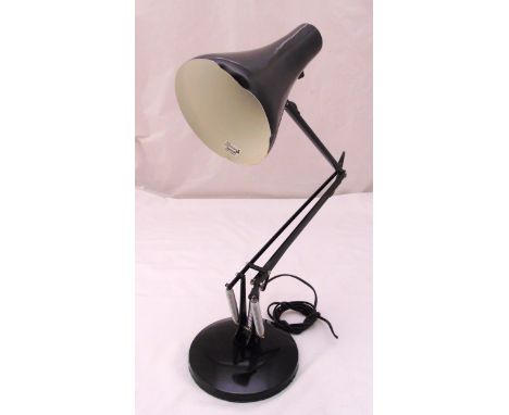 Anglepoise black enamel desk lamp of customary form on raised circular base, A/F
