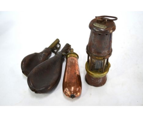A miner's 'Baby Wolf' lamp by Wolf Safety Lamp Co, William Maurice Ltd, Sheffield, 19 cm high, to/w a copper and brass powder