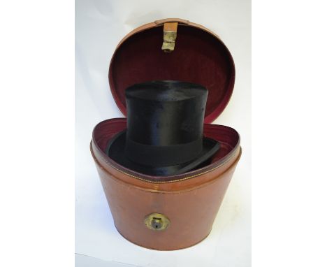 A vintage black silk top hat retailed by Alf &amp; Pellett Ltd., Cross St and Royal Exchange, Manchester, 56 cm circ., 20 cm 