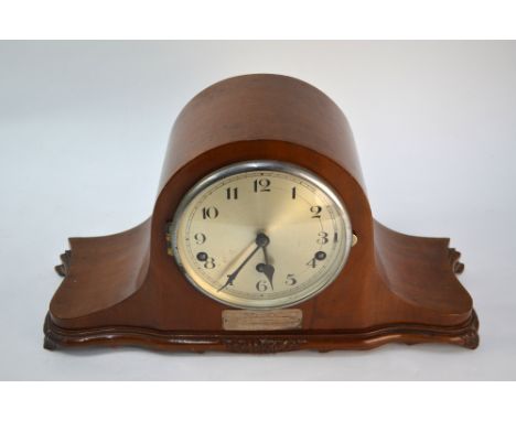 A 1940s walnut cased eight-day three train mantel clock with Westminster chimes, bears presentation plate, from Norley Home G