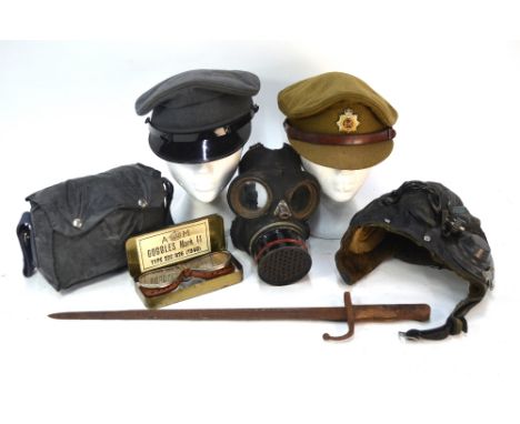 A vintage sheepskin-lined leather flying helmet with integral headphones to/w a pair of Air Ministry Goggles Mark II type 22C