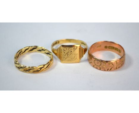 A 9ct rose gold engraved wedding band, size O 1/2 to/w 9ct yellow gold signet ring (size R) and 9ct yellow gold twisted ring 