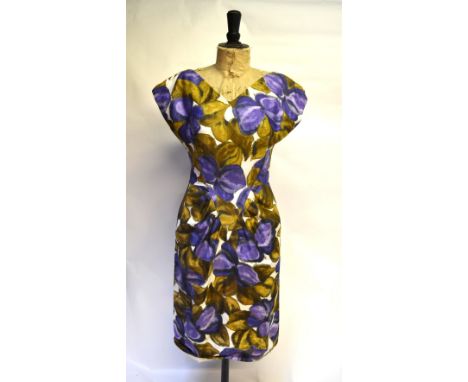 A 1950s satinized cotton day dress in bold floral print, purple/brown on white ground, by Sambo Fashions, 52 cm across chest 