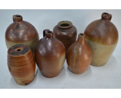 An 18th century brown-glazed stoneware flagon, impressed '2', 35 cm high, to/w three named 19th century flagons - Jas Paul Wi