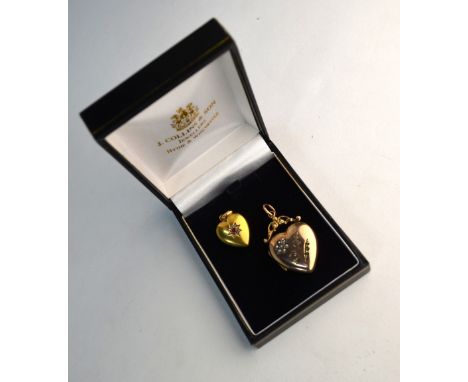 Two heart-shaped lockets, one 15ct set with ruby and diamonds, and one yellow metal with small emeralds and half pearls (2)
