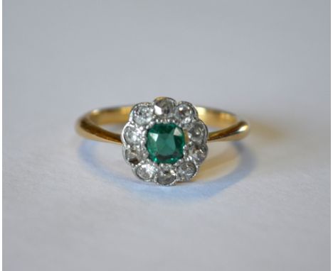 An emerald and diamond cluster ring, yellow and white metal millgrain setting stamped 18ct, size KSetting in poor condition, 