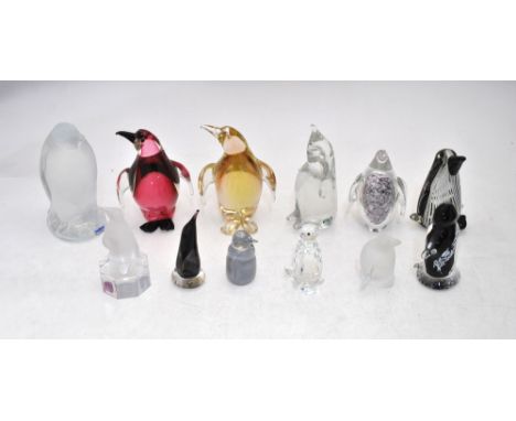 Twelve glass penguins including Scandinavian examples, a Swarovski Crystal penguin, Goebel penguin, Tweedsmuir glass penguin 