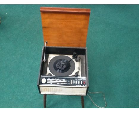 A Dansette Musique floor standing 1960's record player, full auto changer by Monarch, on four wooden legs (in need of a clean