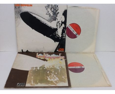 Two Led Zeppelin vinyl 33rpm records, Vols 1 and 2 on Atlantic plum labels, sleeves and records in VG Condition.