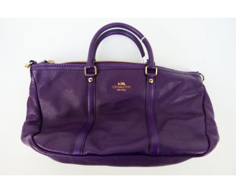 Coach New York - a Purple Coach handbag, labelled with makers mark, with shoulder strap,this item appears to be in near mint 