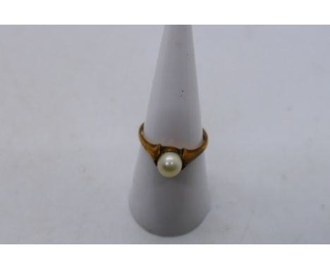 A 9ct rose gold pearl solitaire ring, size O, 2.7 grams.