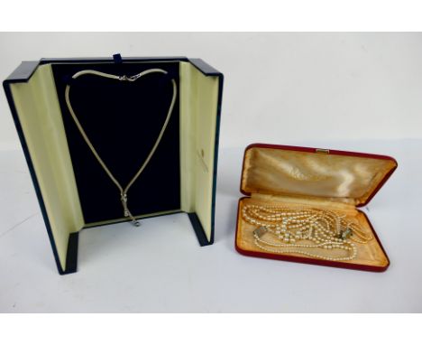 Two multi-strand pearl bead necklaces and a white metal necklace, stamped 925 to the clasp. [2]. [W]