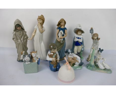 A collection of Nao figures / groups, largest approximately 29 cm (h) and a Lladro bell. [W]