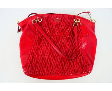 Coach New York - a Red Coach handbag, labelled with makers mark, with shoulder strap,this item appears to be in near excellen