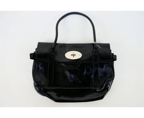 Mulberry - a black patent leather Mulberry handbag, labelled with markers, original price tag inside zip pocket displaying pu