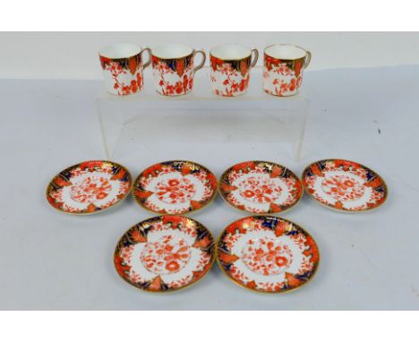 Royal Crown Derby - four coffee cans and six saucers decorated in the Imari palette, # 2712, the cans 5 cm (h) and the saucer