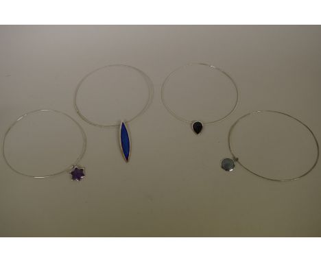 Two Rachel Gogerly silver and enamel pendants,&nbsp;on wire collars; together with two similar examples, unmarked. (4) 