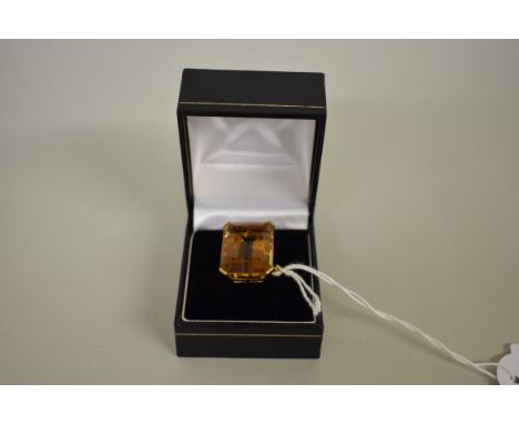 A large emerald cut orange topaz gold cocktail ring, stamped 18ct. 