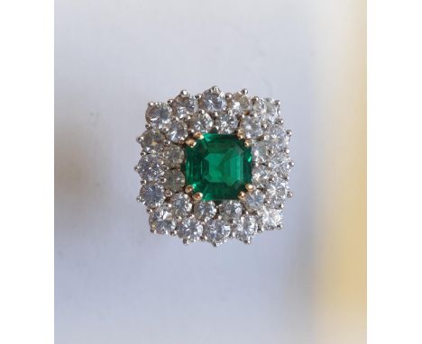 A square cut emerald and diamond ring,&nbsp;the double row of diamonds totalling approximately 3ct, stamped .750. 