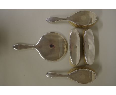 A&nbsp;silver&nbsp;five piece engine turned dressing set, by Charles S Green &amp; Co Ltd, Birmingham 1919-21. 