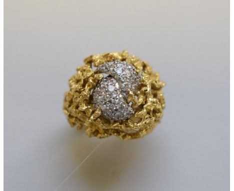 An Andrew Grima style diamond and gold cocktail ring, stamped 18ct, 15.5g total weight. 