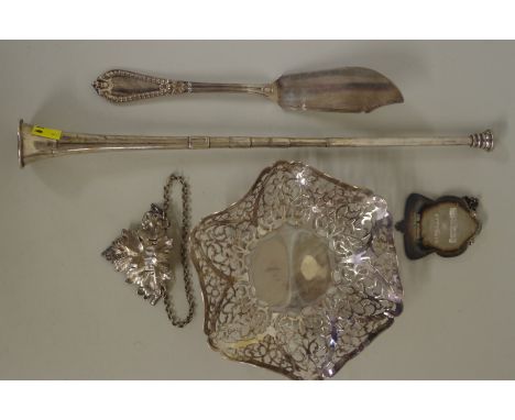 A small group of silver items, comprising: a&nbsp;pierced silver dish; a silver fish knife; a small silver hunting horn; and 
