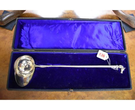 A cased&nbsp;electroplated&nbsp;novelty jockey's cap and whip ladle. 