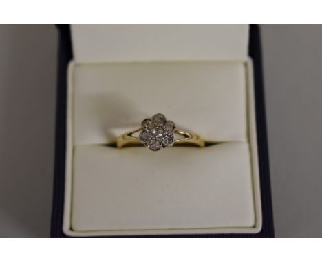 A gold&nbsp;diamond daisy&nbsp;ring, stamped 18ct. 