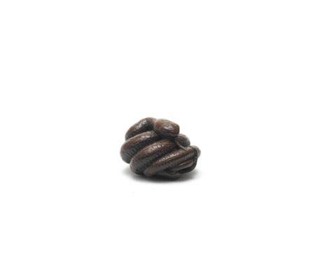 A WOOD NETSUKE OF A COILED SNAKEEdo period (1615-1868) or Meiji era (1868-1912), 19th centuryThe snake with its body coiled i