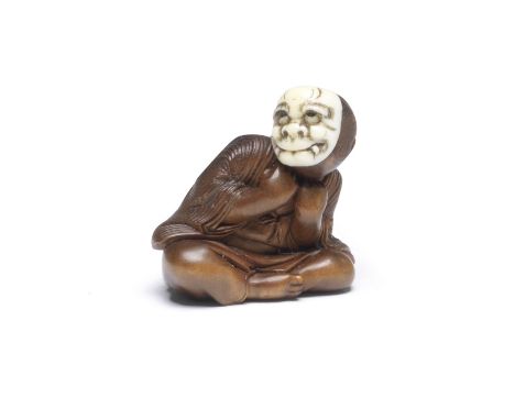 A WOOD NETSUKE OF A BOY WITH AN ONI (DEMON) MASKBy Hojitsu, Edo period (1615-1868), mid 19th centuryThe boy seated and leanin