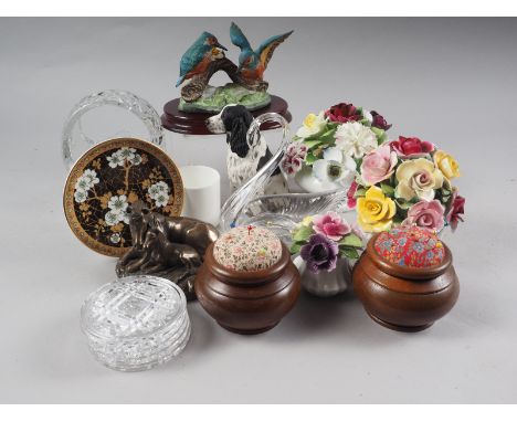 A Royal Doulton ceramic floral display, two other floral displays, two pin cushions, a glass basket, a number of brass bells 