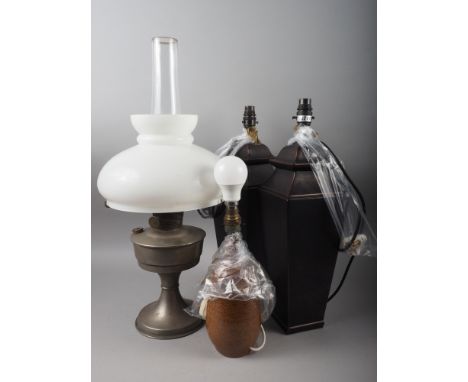 An oil lamp, a pair of bronzed ceramic table lamps and a Portuguese brown stoneware table lamp 