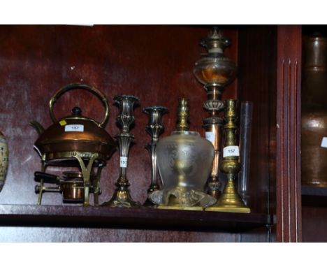 A pair of silver plate on copper candlesticks, 9 1/2" high, a similar oil lamp, 16 1/2" high , a pair of brass candlesticks, 
