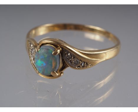 A yellow metal ring, stamped K 18, set black opal doublet and rose diamond shoulders, size O 1/2, 3g gross 