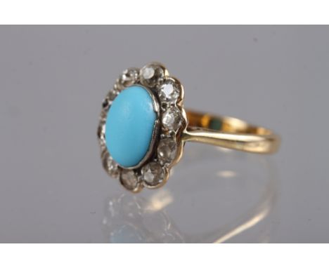 A yellow metal dress ring, set turquoise and collar of diamonds, stamped 18ct, size K 1/2, 34g gross 