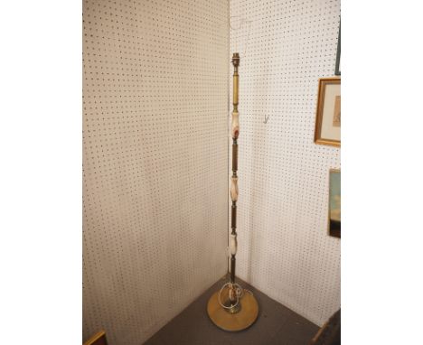 An onyx and brass standard lamp, on circular base, 53 1/2" high 