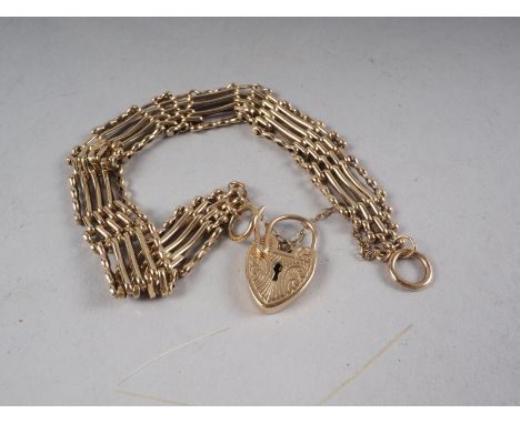 A 9ct gold five-bar gate bracelet with engraved lock, 21g 