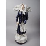A Royal Dux porcelain figure of a faggot gatherer, 12 1/2" high